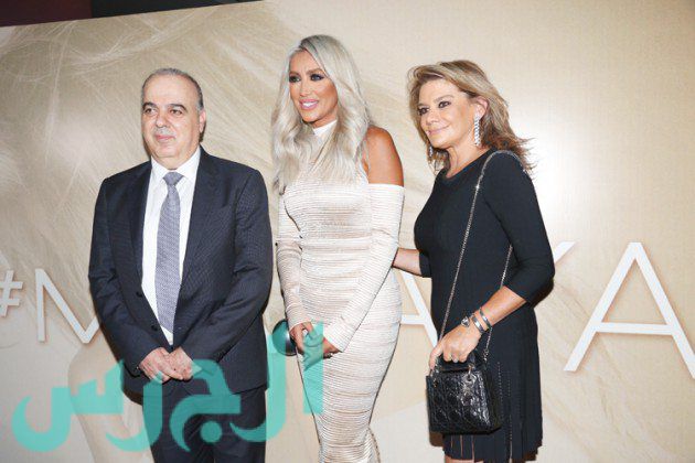 وزير الصحة السابق محمد خليفة وزوجته مع مايا دياب