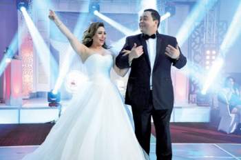 بوسي وأحمد رزق يحتفلان بزفافهما في فيلم (يجعله عامر)